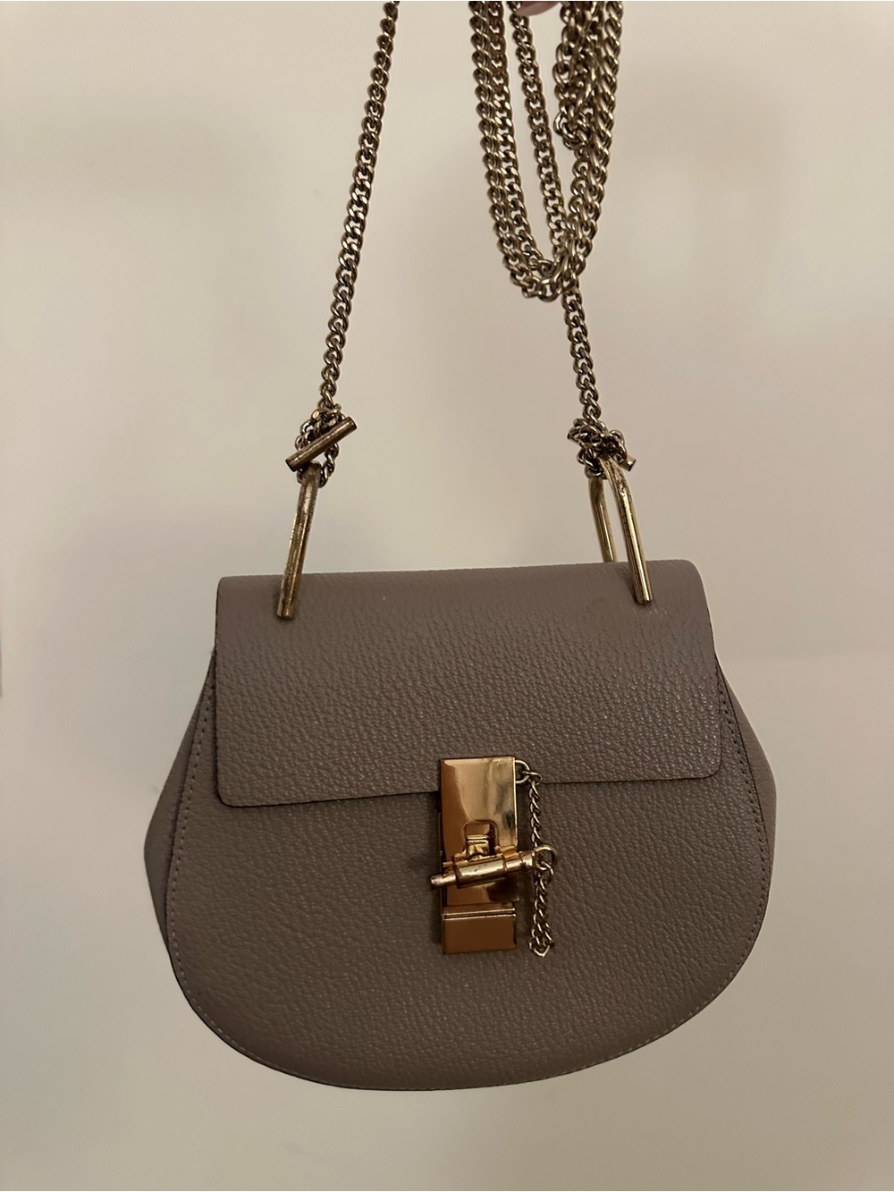 Taupe Leather Saddle Bag with Gold Chain Strap